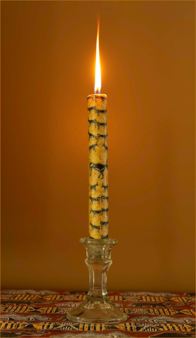 39 A burning candle in a candle stick - Gloria Melnychuk